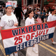 Three girls march toward the White House on Elm St. in Washington, DC, as part of the Inderpendance Day Parade.